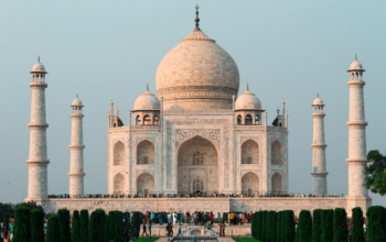 The Taj Mahal stands majestic in white marble, embodying love and Taj Mahal history